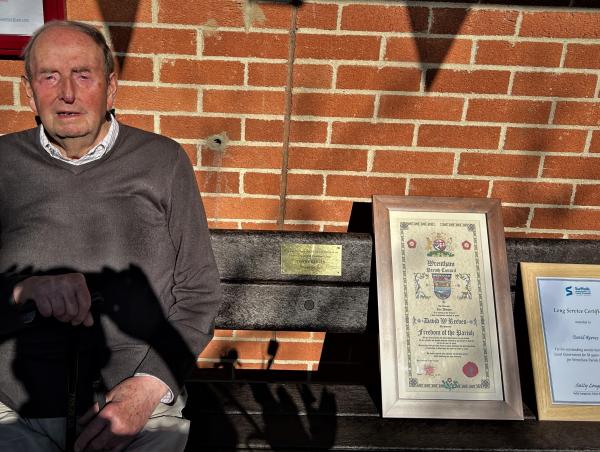 David Reeves with bench scroll and long service certificate 2
